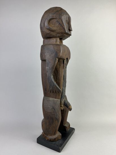 Male statue depicted standing with arms at...