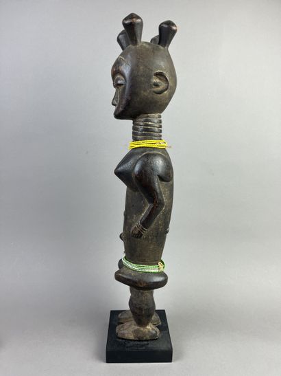 Standing female statue with arms detached...