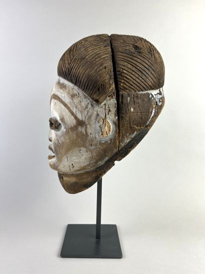 Okuyi facial mask, portrait of a young girl....