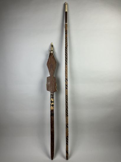 Two ceremonial dance sticks in the form of...