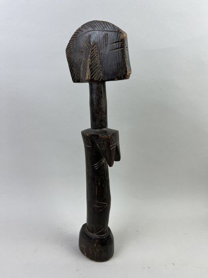 Fertility doll. Wood with brown patina. Height:...