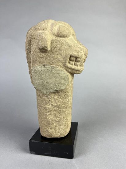 Feline head from an anthropo-zoomorphic deity....