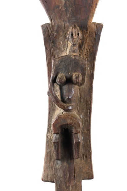 Toguna. Pillar sculpted in high relief of...