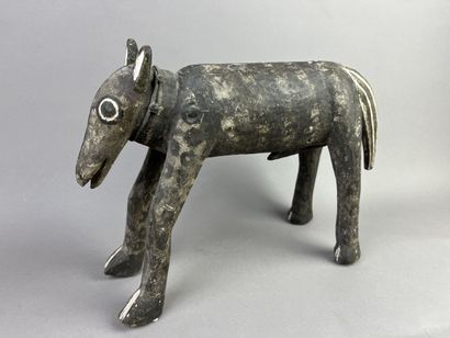 Sculpture of a horse resting on its four...
