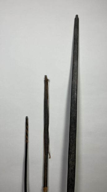 Three bows: One dark palmwood bow without...