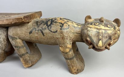 Seat composed of two animals side by side....
