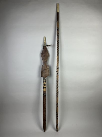 Two ceremonial dance sticks in the form of...