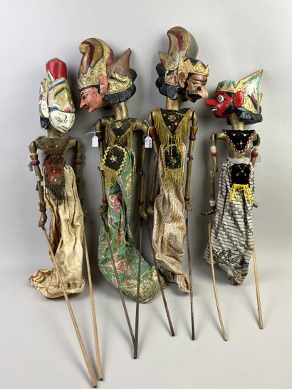 Four Wayang Golek rod puppets. The carved...