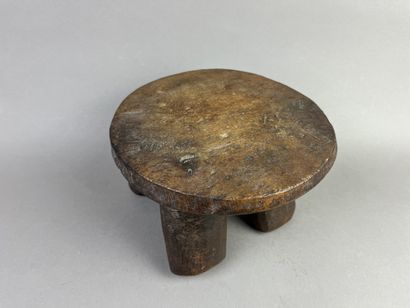 Small stool on four legs. Brown patina wood....