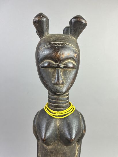 Standing female statue with arms detached...