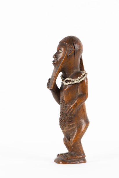 Mukuya ancestor. Male statuette, shown standing...