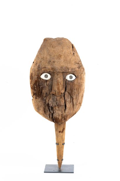 Funerary bundle mask. The face has a rather...