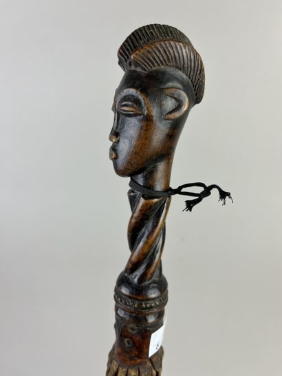 Flycatcher. The handle depicts a human head...