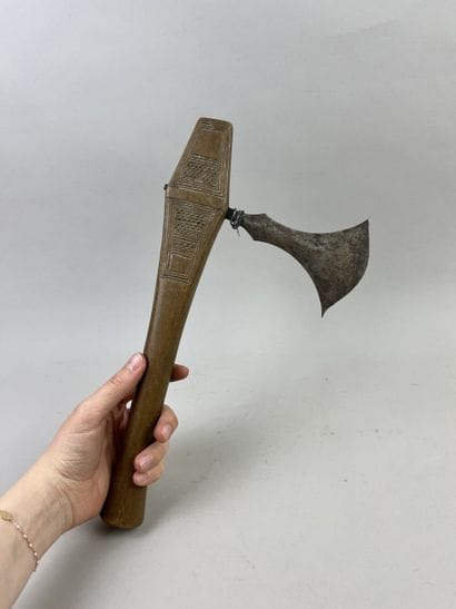 Axe with iron blade set in a wooden handle...
