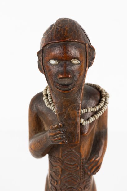 Mukuya ancestor. Male statuette, shown standing...