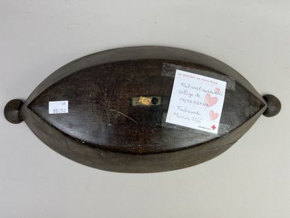 Food dish decorated with a rim incised with...