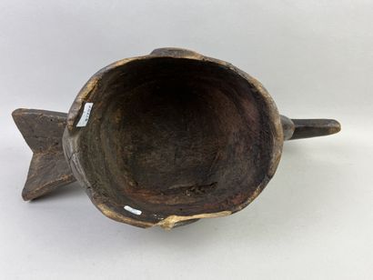 Helmet mask. This headdress depicts a bird,...