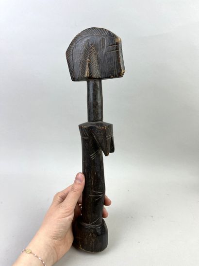 Fertility doll. Wood with brown patina. Height:...