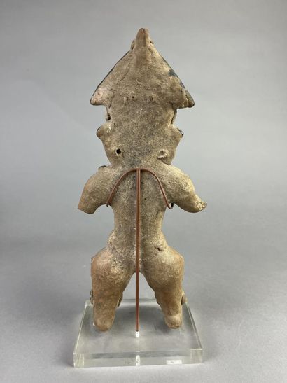 Standing female statuette wearing a cone-shaped...