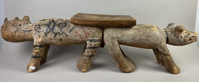 Seat composed of two animals side by side....