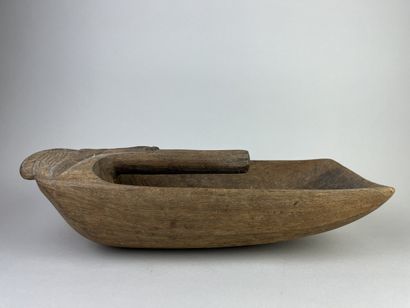 Pirogue scoop carved with a stylized human...