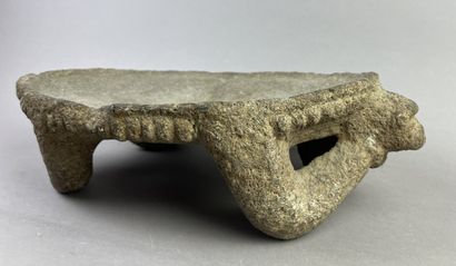Metate. Corn grinding table. The top is supported...