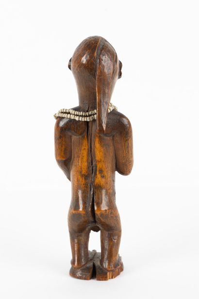 Mukuya ancestor. Male statuette, shown standing...