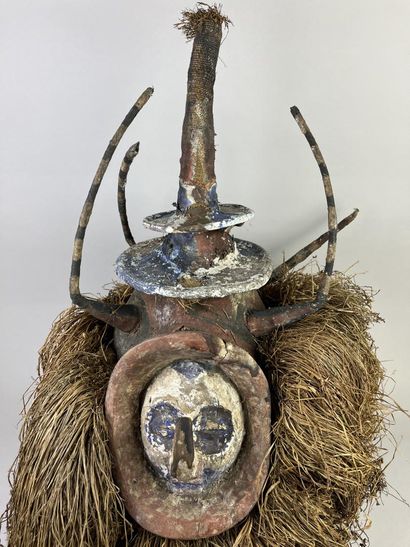 N'eemba helmet mask. Human face surmounted...