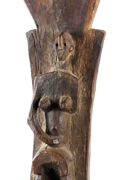 Toguna. Pillar sculpted in high relief of...
