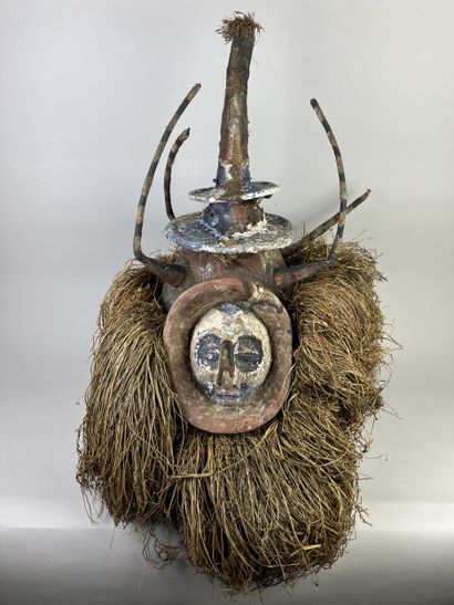 N'eemba helmet mask. Human face surmounted...
