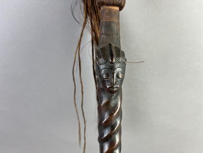 Fly swatter. The twisted handle is decorated...