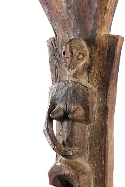 Toguna. Pillar sculpted in high relief of...