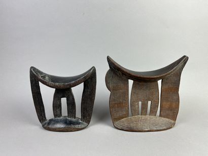 Two neck rests decorated with geometric motifs....