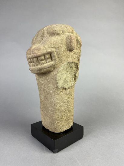 Feline head from an anthropo-zoomorphic deity....