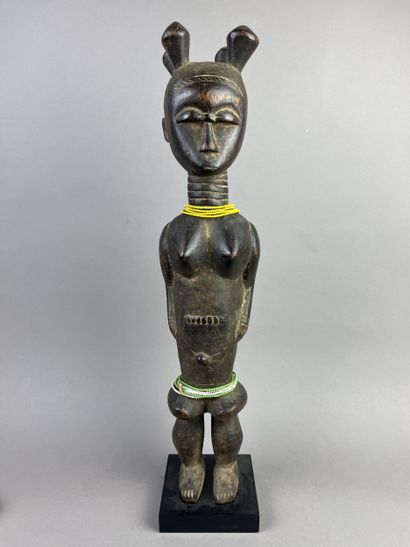Standing female statue with arms detached...