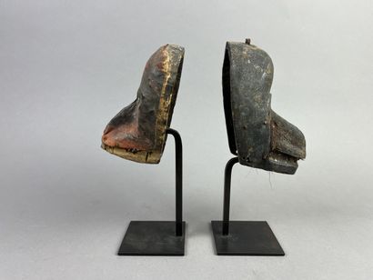 Two diminutive masks. Wood with earthy patina,...