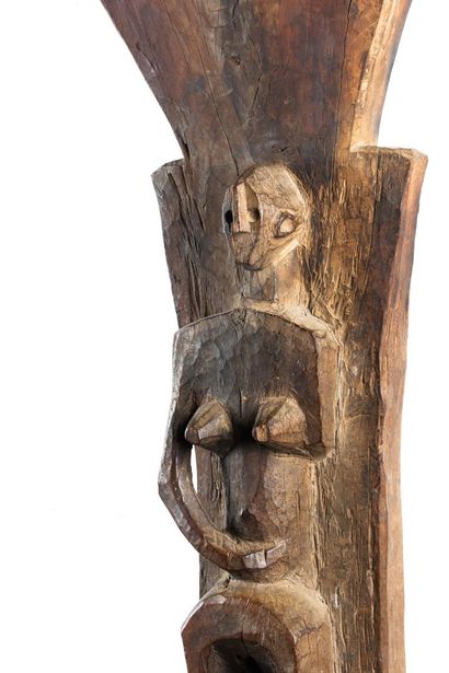 Toguna. Pillar sculpted in high relief of...