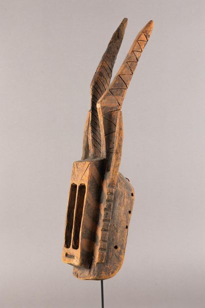 Wallu mask. The rectangular face is divided...