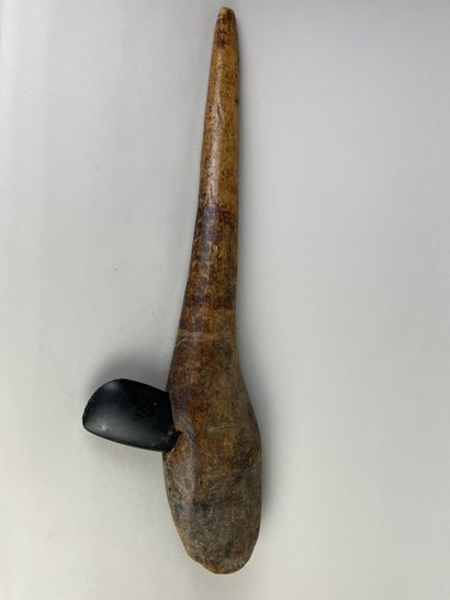Axe with monoxyle handle and mortised blade....