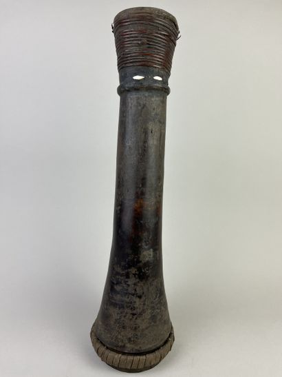 Hand drum (kundu) with flared ends and a...