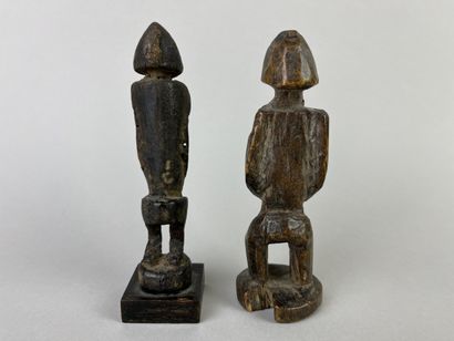 Two antique cubist-style small fetishes shown...