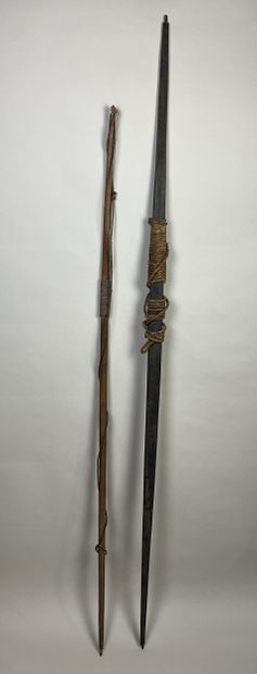 Two bows: An antique palmwood bow with dry...