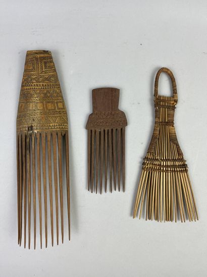 Three combs: one with eleven teeth (one missing)...