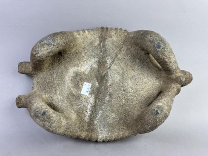 Metate. Corn grinding table. The top is supported...