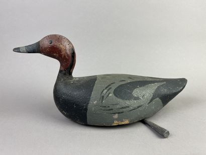 Antique wooden duck caller. Presence of its...