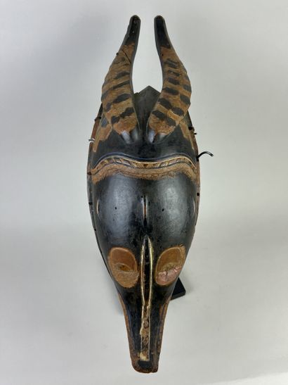 Old zamble mask. Representation of an antelope....