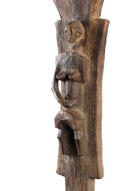 Toguna. Pillar sculpted in high relief of...