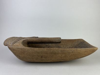 Pirogue scoop carved with a stylized human...