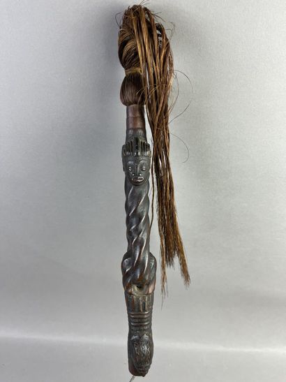Fly swatter. The twisted handle is decorated...