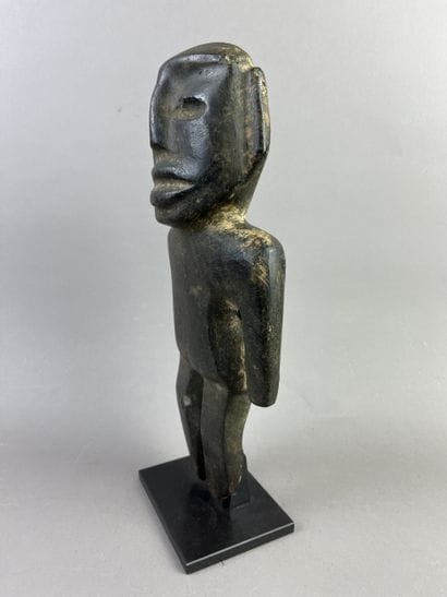 Anthropomorphic idol. Standing figure, arms...